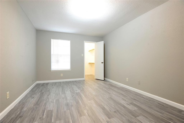 9700 Leawood Blvd Unit 2110, Houston, TX 77099 - empty room with wood finished floors and baseboards