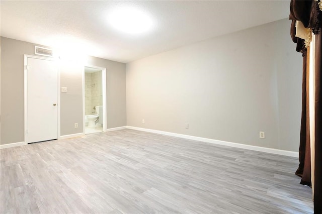 spare room with light wood-type flooring