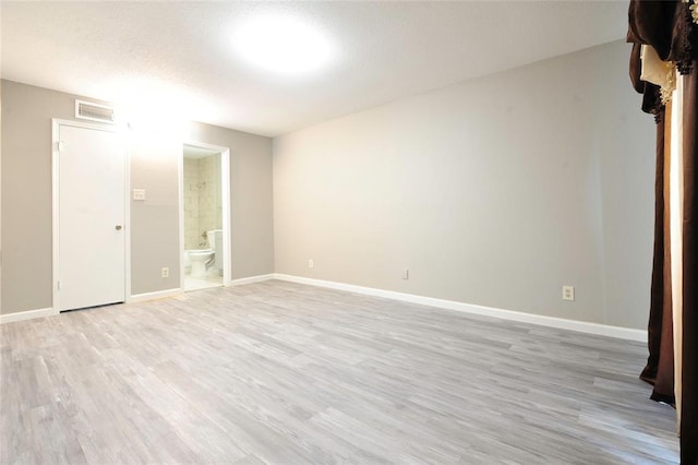 9700 Leawood Blvd Unit 2110, Houston, TX 77099 - spare room featuring light wood-style flooring and baseboards