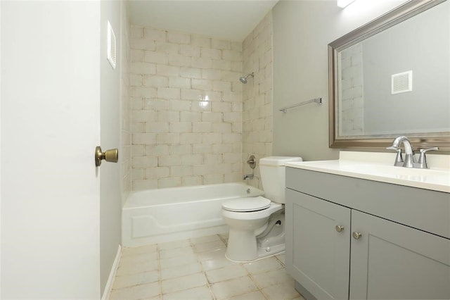 full bathroom with toilet, tiled shower / bath, and vanity