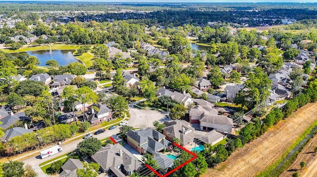 aerial view featuring a residential view and a water view