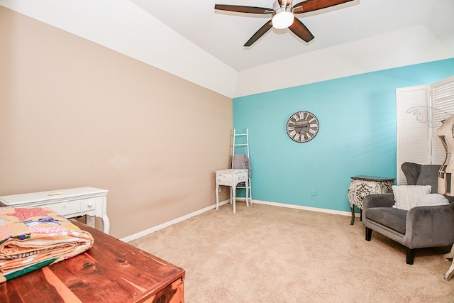 sitting room featuring carpet floors, baseboards, and a ceiling fan