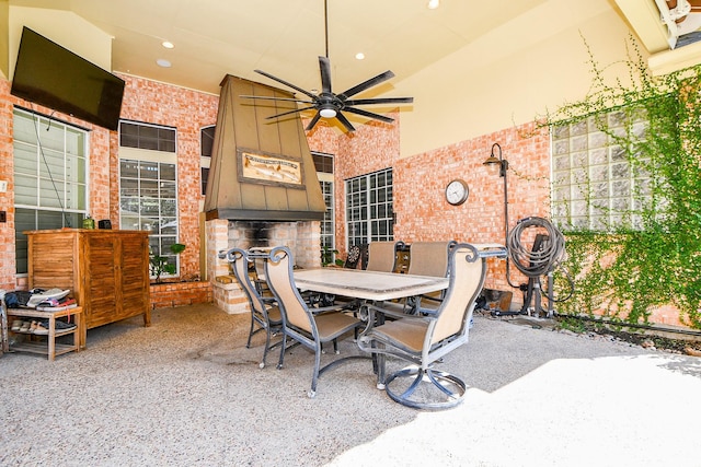 view of patio with a ceiling fan and outdoor dining area