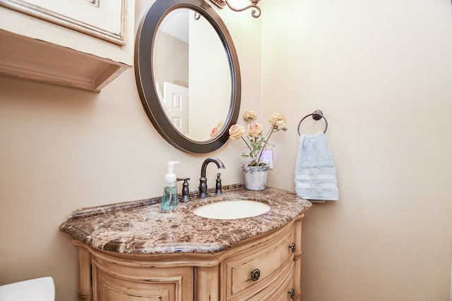 half bath with vanity and toilet