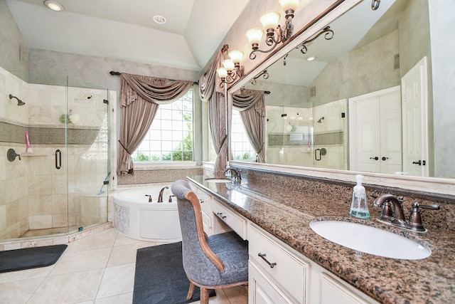 full bathroom featuring lofted ceiling, a garden tub, a sink, a shower stall, and double vanity