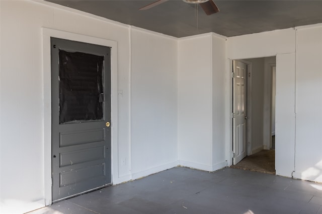 interior space with ceiling fan