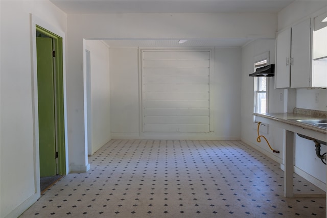 kitchen featuring white cabinets