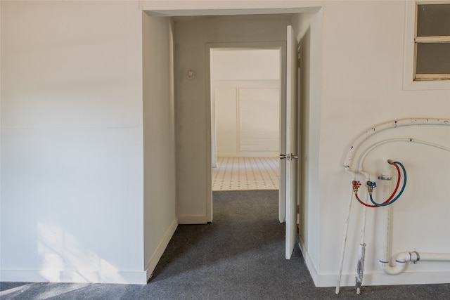 hallway with carpet floors