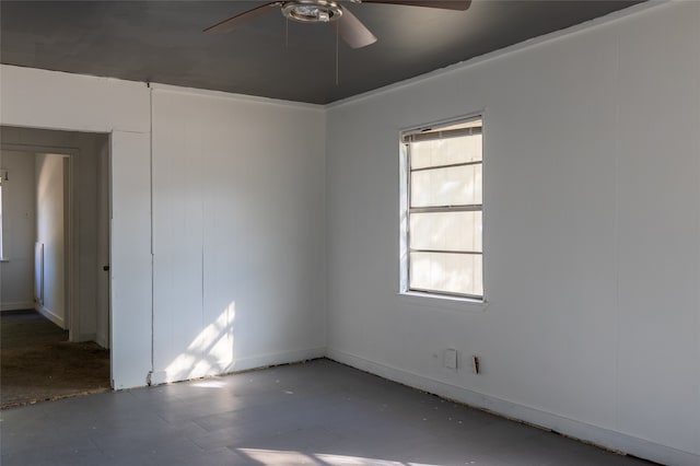 unfurnished room with ceiling fan and plenty of natural light