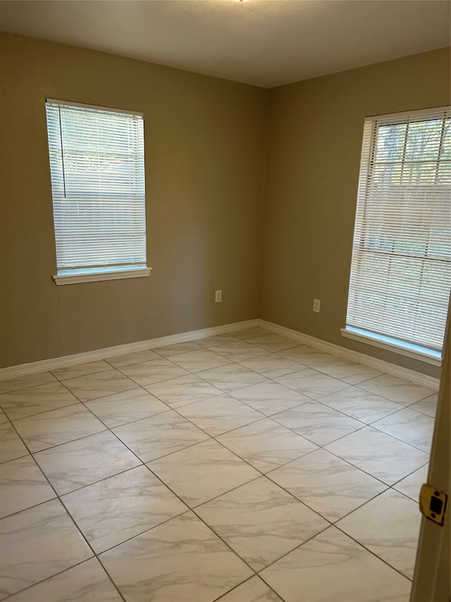 unfurnished room with a wealth of natural light