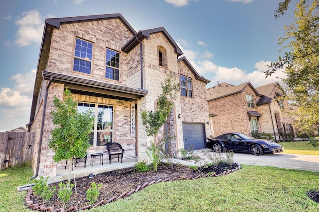 view of front of house featuring a front lawn and a garage