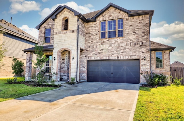 view of front of house with a garage and a front yard