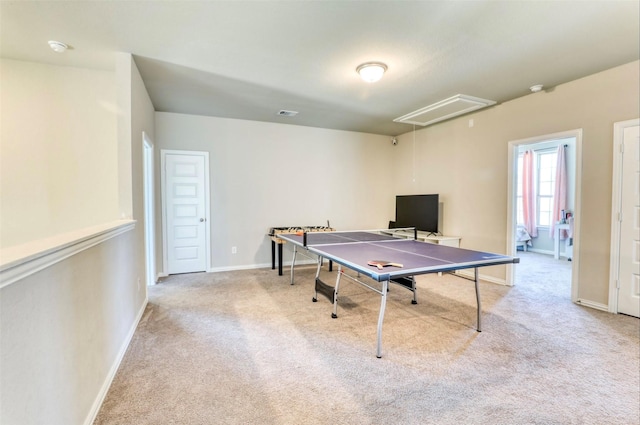 rec room with light colored carpet