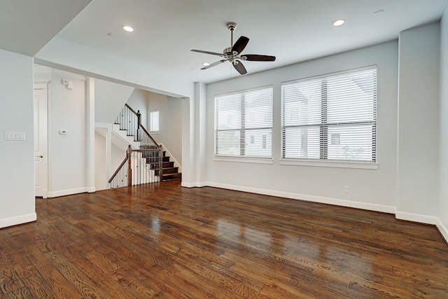 unfurnished room with ceiling fan and dark hardwood / wood-style floors