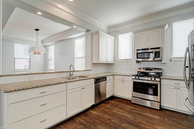 kitchen featuring dark hardwood / wood-style floors, sink, white cabinets, appliances with stainless steel finishes, and light stone counters