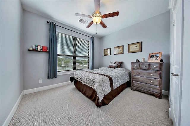 bedroom featuring light carpet and ceiling fan