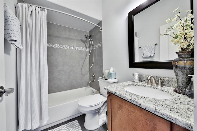 full bathroom with vanity, shower / bath combo, and toilet