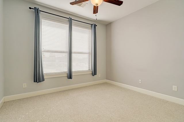 spare room with ceiling fan and carpet flooring