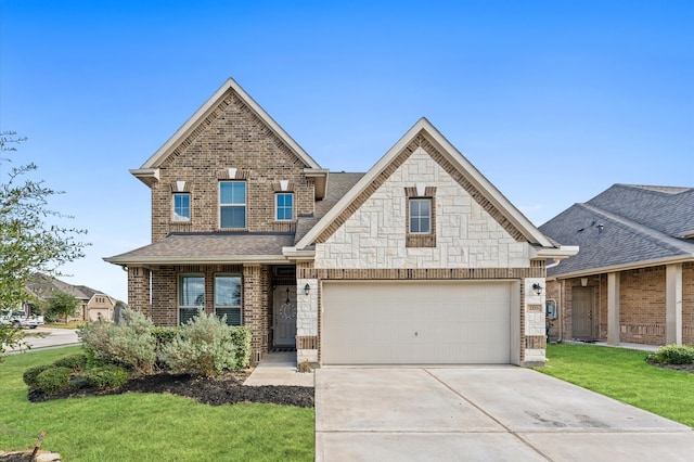 craftsman house with a front yard and a garage