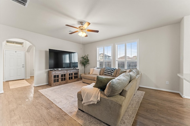 living room with ceiling fan and wood-type flooring