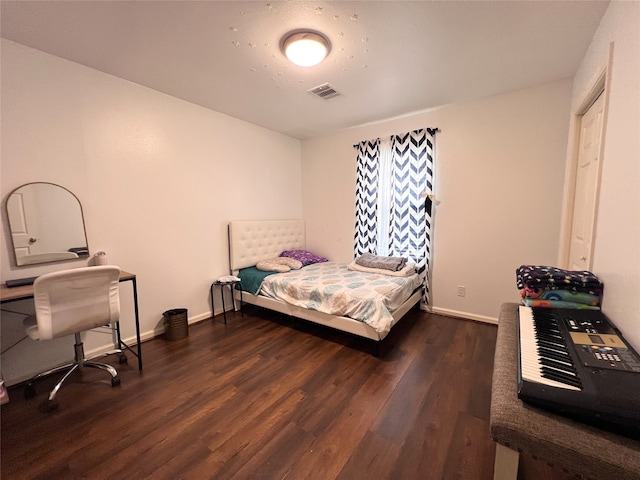 bedroom featuring dark wood-type flooring