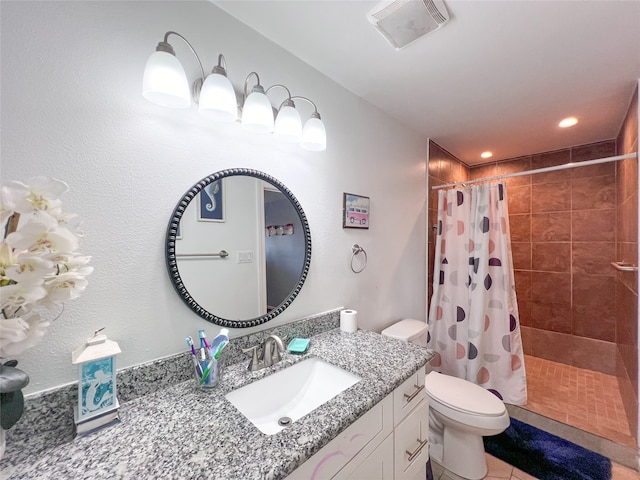 bathroom with toilet, a shower with curtain, vanity, and tile patterned flooring