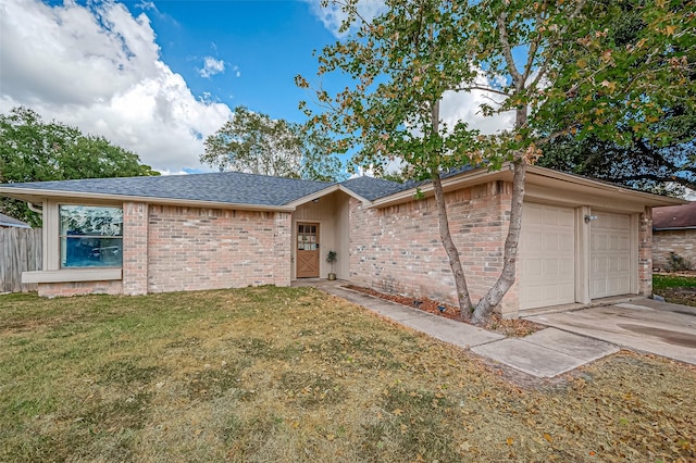 ranch-style home with a front yard and a garage