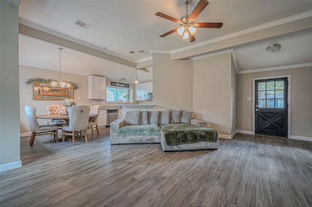 living room featuring hardwood / wood-style floors, plenty of natural light, and crown molding