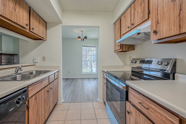 kitchen with sink, dishwasher, stainless steel electric stove, a notable chandelier, and light hardwood / wood-style flooring