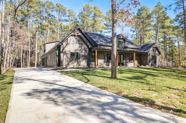 view of front of property with a front yard and a porch