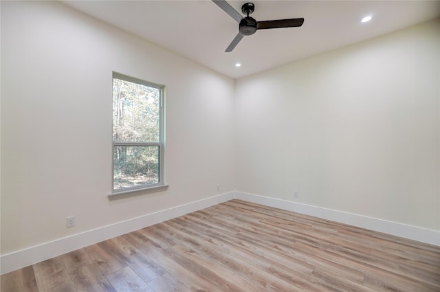 unfurnished room featuring ceiling fan and light hardwood / wood-style floors