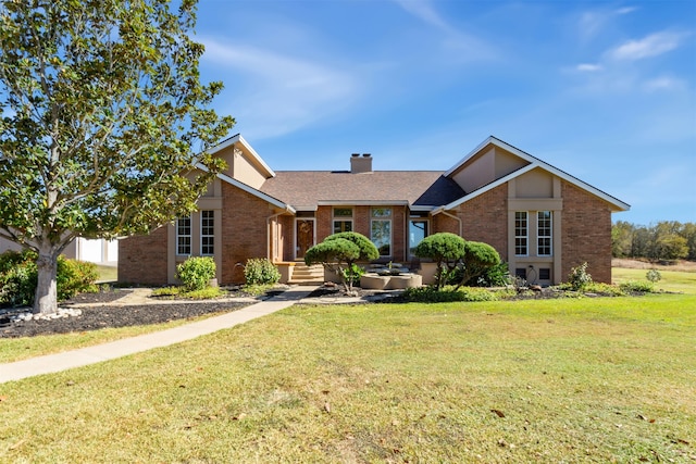 ranch-style home featuring a front lawn