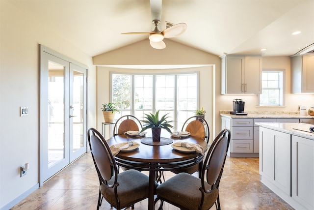 dining space featuring french doors, ceiling fan, and lofted ceiling