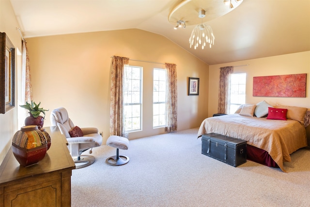 bedroom with lofted ceiling and light colored carpet