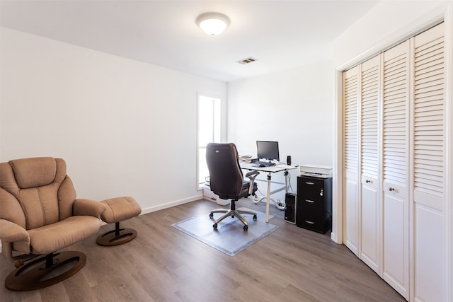 office with light hardwood / wood-style floors