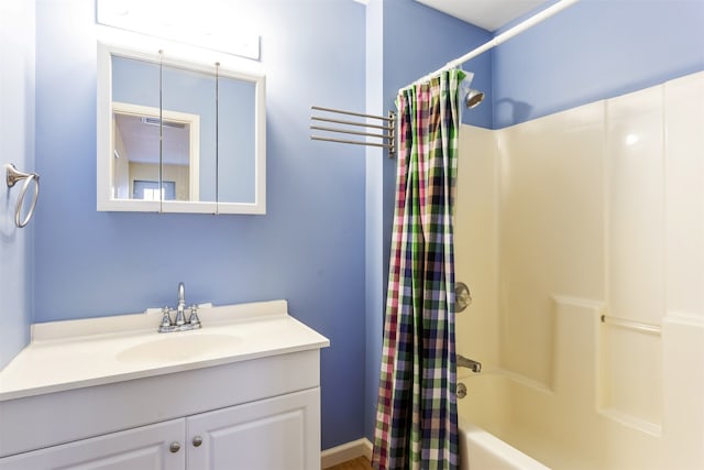 bathroom featuring vanity and shower / bath combo