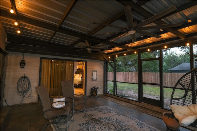 sunroom with a wealth of natural light and ceiling fan