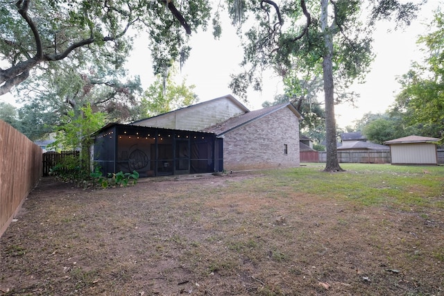 view of yard with a sunroom