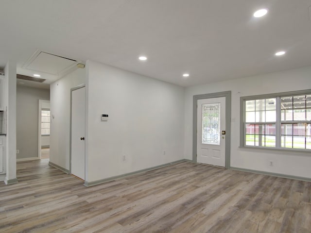 foyer entrance with light wood-type flooring