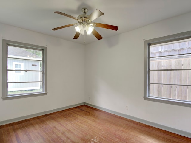 empty room featuring light wood-type flooring and ceiling fan