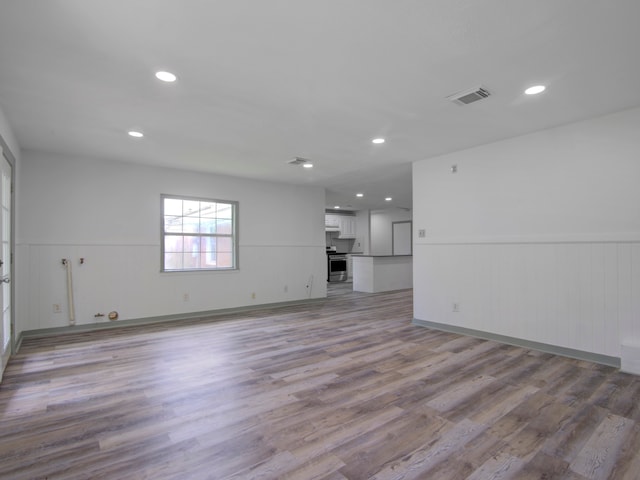 unfurnished living room with light hardwood / wood-style flooring