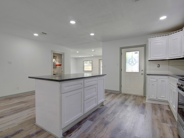 kitchen with white cabinetry and a healthy amount of sunlight