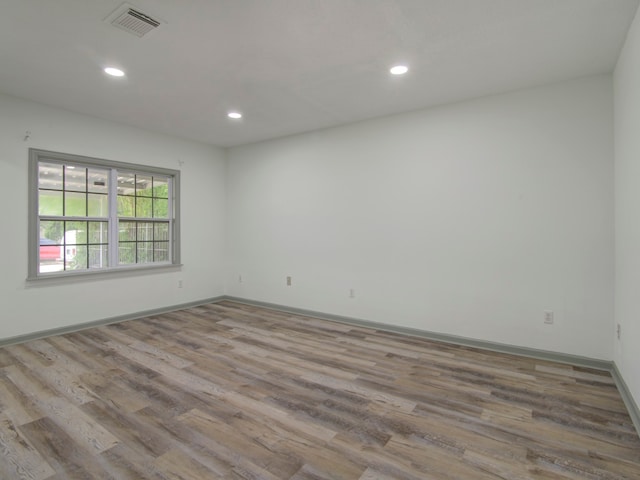 unfurnished room featuring light wood-type flooring