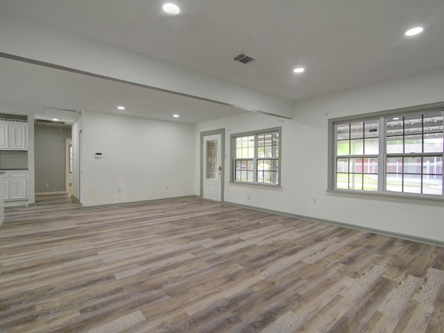 unfurnished living room featuring light hardwood / wood-style floors