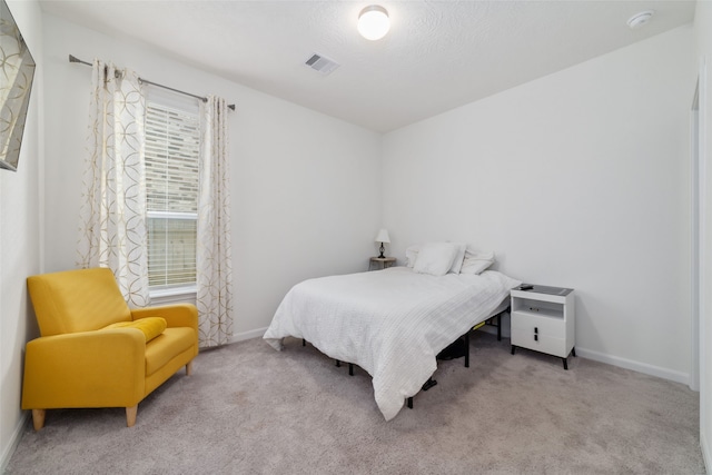 bedroom featuring light carpet