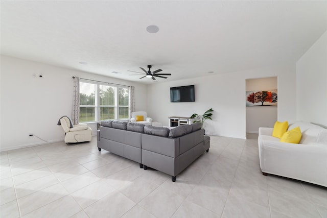 living room with ceiling fan and light tile patterned floors