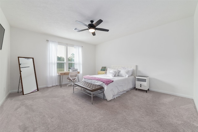 bedroom featuring light colored carpet and ceiling fan