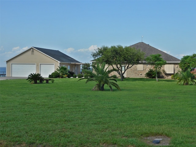 view of yard featuring a garage