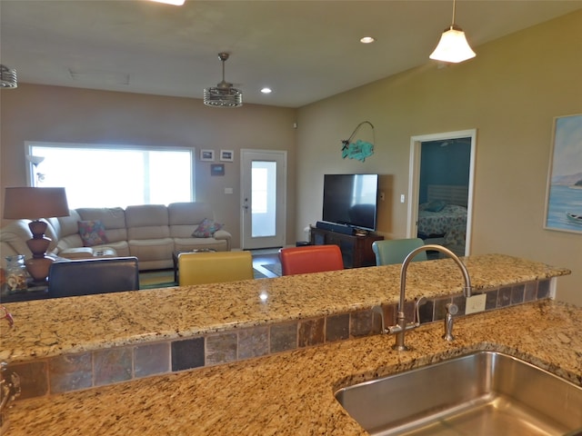 kitchen with decorative light fixtures and sink