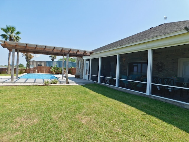 view of yard featuring a fenced in pool, a patio area, and a sunroom